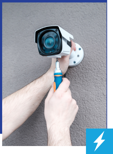 coolwind cctv expert fixing cctv camera on to a wall Air Conditioning and Electrical Solutions